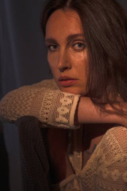 Portrait of a young woman. Natural beauty and unique charm of a young girl. A beautiful and gentle portrait. A sensual look and beautiful light create naturalness and mystery.