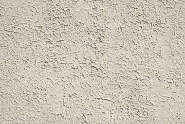 Yüksek çözünürlüklü tam kare görüntü, kaba, çatlak alçı yüzeyli bej kaplama duvar dokusu. Mimari arka plan, inşaat tasarımı veya soyut sanat. Grunge deseni ve yıpranmış, kumlu kaplama doğal, kırsal ayrıntı.