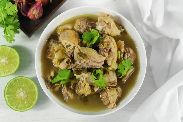 stock image Homemade chicken soup with galangal,  lemon grass in white bowl.