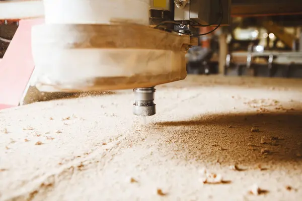 stock image Close-up shot of machine with numerical control cuts wood. Cnc tool. Woodworking industry.