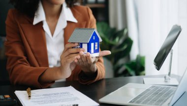 Signed the house buy a contract with the house sales agents. Buy or sell home concept. Happy in marketing signing contract of house