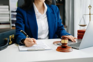 justice and law concept.Male judge in a courtroom on wooden table and Counselor or Male lawyer working in office. 