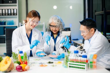 Team of scientists examining food samples in a lab with microscopes. Perfect for themes of food science, biotechnology, and nutrition research teamwork