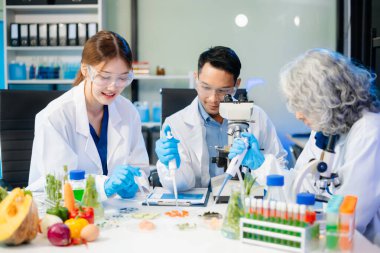 Team of scientists examining food samples in a lab with microscopes. Perfect for themes of food science, biotechnology, and nutrition research teamwork