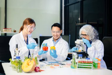 Team of scientists examining food samples in a lab with microscopes. Perfect for themes of food science, biotechnology, and nutrition research teamwork