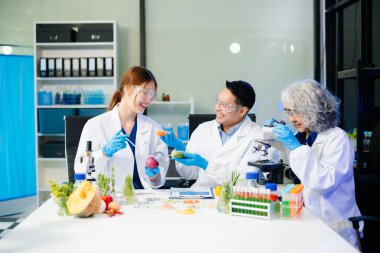 Team of scientists examining food samples in a lab with microscopes. Perfect for themes of food science, biotechnology, and nutrition research teamwork
