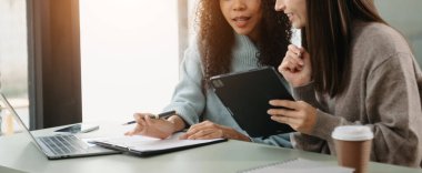  Team work process. Photo young business crew working with new startup project. Project managers meeting. Analyze plans, papers. At office