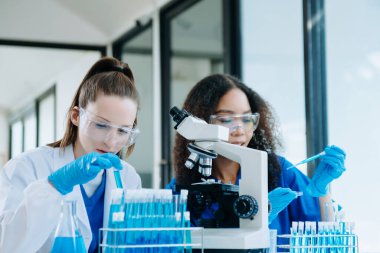 Modern Medical Research Laboratory Portrait of Two African American Scientists Working, Using Digital Tablet, Analyzing Samples, Talking. for Medicine, Biotechnology Developmen