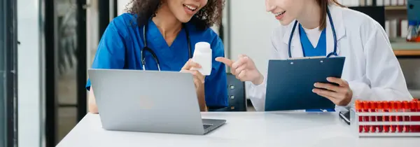 Modern Medical Research Laboratory Portrait of Two African American Scientists Working, Using Digital Tablet, Analyzing Samples, Talking. for Medicine, Biotechnology Developmen