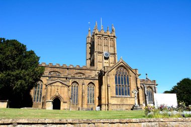 Front view of St Marys Minster Church in the town centre with the graveyard in the foreground, Ilminster, Somerset, UK, Europe clipart