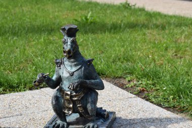 The Wawel Dragon sculpture stands at the foot of Wawel Castle in Krakow Poland. This iconic monument represents the legendary dragon from Polish folklore.