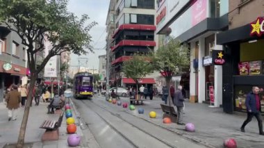 Kadikoy,istanbul,Turkey-January 22,2023..Touristic trip from Kadikoy to Moda by nostalgic tram in istanbul and Bahariye street view with people.