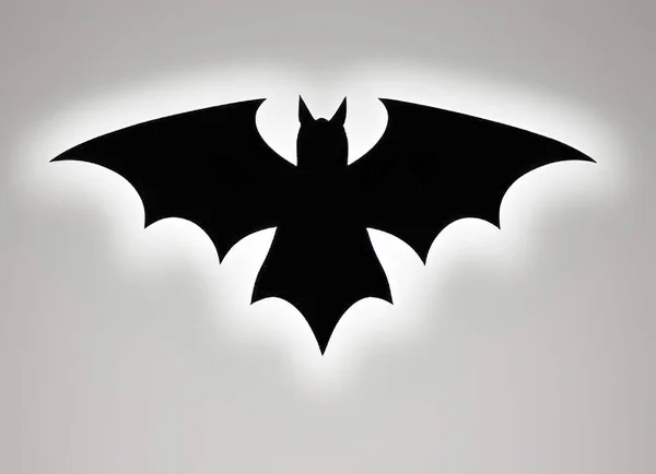 蝙蝠的轮廓在白色背景下被隔离 万圣节的标志 矢量图解 纹身设计 白色背景上的蝙蝠图标 — 图库矢量图片