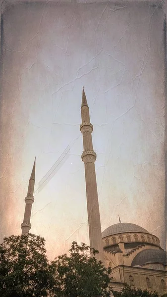 stock image early hours of the morning. twilight. Mosque minarets and crescent moon.