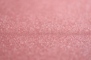 Güzel pembe parıltı dokuyu arka plan olarak kıvılcımlar ve yüzeysel alan derinliği