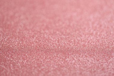 Güzel pembe parıltı dokuyu arka plan olarak kıvılcımlar ve yüzeysel alan derinliği