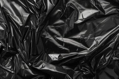 Buruşmuş siyah politen plastik ambalaj kağıdı görüntüsü. Arkaplan kullanımı için doku