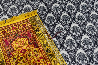 prayer rug, mosque and prayer rug, close-up rosary and prayer rug,Prayer is performed on the prayer rug laid in the masjid,