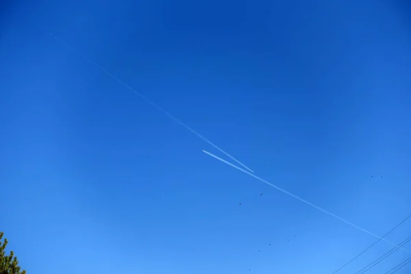 blue sky and two planes face to face, two planes in the air,