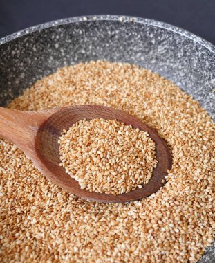 close-up of a large amount of cooked sesame seeds,