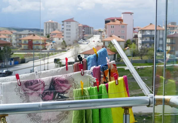 Laundry drying on the clothes hanger on the balcony, clothes hanging on the rope on the balcony,