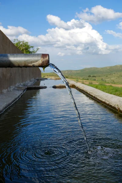 stock image close-up of drinking water fountain flowing from the pipe,clear water flows from the fountain,