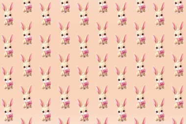 Sevimli Paskalya tavşanları içeren basit ve kusursuz bir vektör deseni. Tatil temalı projeler, çocuk ürünleri, hediye paketleri ve şenlikli dijital tasarımlar için ideal.