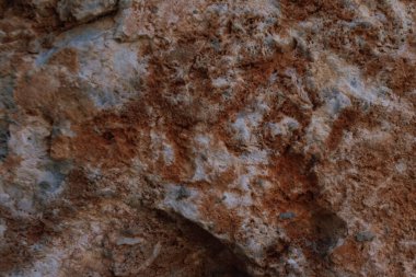 Doğal kırmızı taş arka plan mineral oluşumu ya da yüzeyde yıpranma belirtileri gösteren kaya. Yüksek kalite fotoğraf