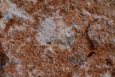 Doğal kırmızı taş arka plan mineral oluşumu ya da yüzeyde yıpranma belirtileri gösteren kaya. Yüksek kalite fotoğraf