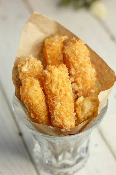 Pile Tasty Cheese Sticks Paper Glass — Stock Photo, Image