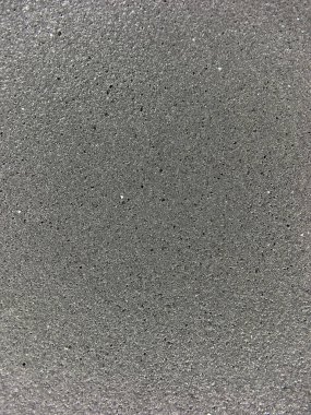 Gri arkaplan dokusuna yakın plan, pürüzsüz geçişleri ve ince soyut desenleri vurguluyor. Dokuya odaklı, modern ve kavramsal hisse senedi tasvirleri için ideal.