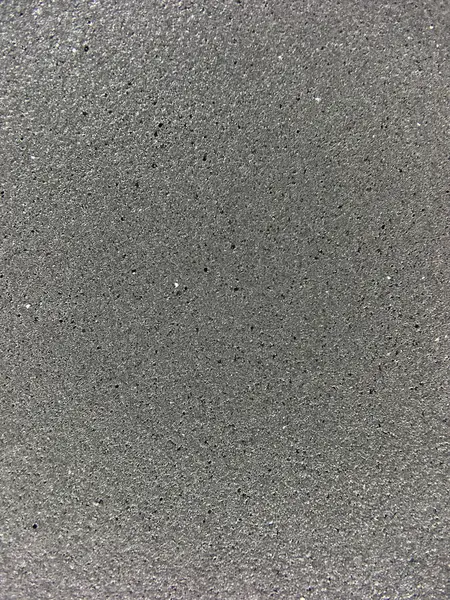 Gri arkaplan dokusuna yakın plan, pürüzsüz geçişleri ve ince soyut desenleri vurguluyor. Dokuya odaklı, modern ve kavramsal hisse senedi tasvirleri için ideal.