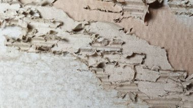 Soyut karton yüzey arkaplanı ve yırtık karton doku.