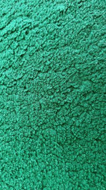 Dokulu yeşil bir halının arka plan fotoğrafı.