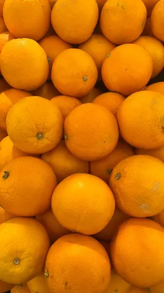 A Close-up View of a Pile of Bright Oranges