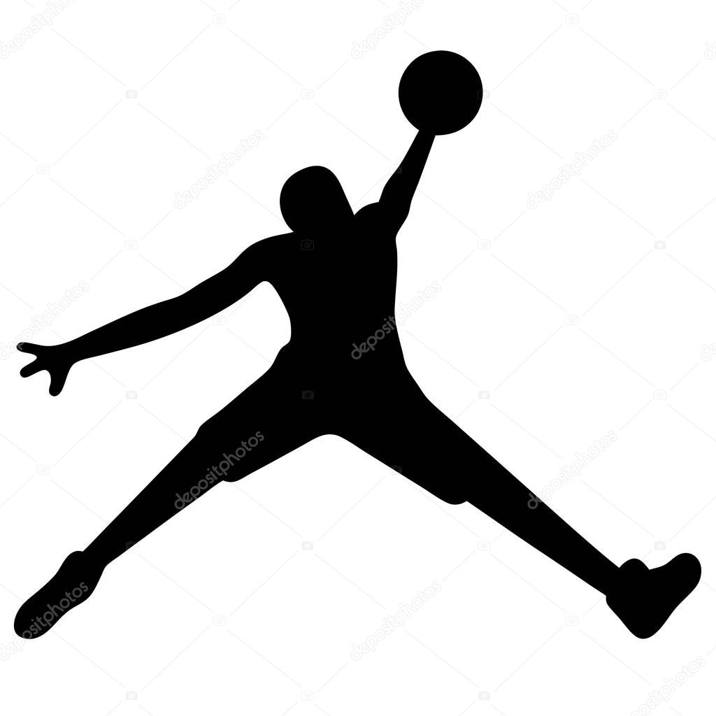 Silhouette of a dynamic basketball player in mid air with ball