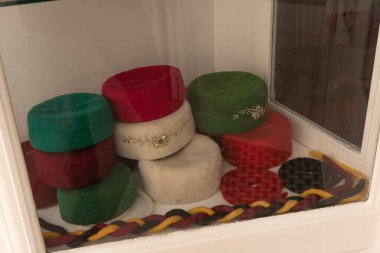 Colourful Tunisian Chechia, traditional soft wool hats popular in the Maghreb region of North Africa for sale in Souk Ech-Chaouachine, the Medina of Tunis, Tunisia 