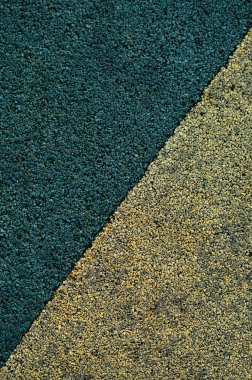 Spor ve atletizm sahaları ve bisiklet yolları için mavi ve sarı dayanıklı kaplama çizgileri. 