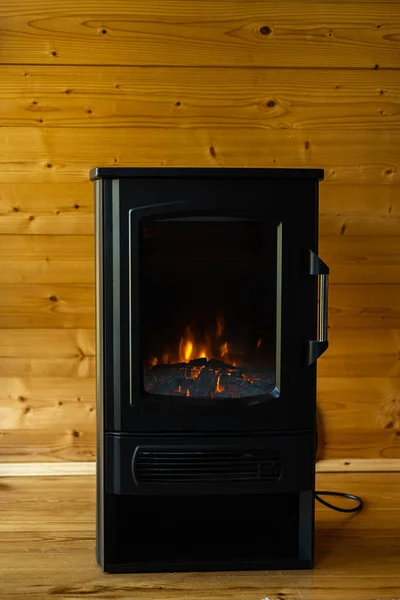 Black Electric Fireplace Effect Flickering Firewood Wooden Interior Vertical Photo — Stock Photo, Image