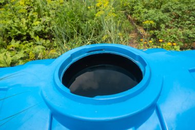 water collection tank under a roof with a drain. Rain water harvesting architecture. Top view clipart