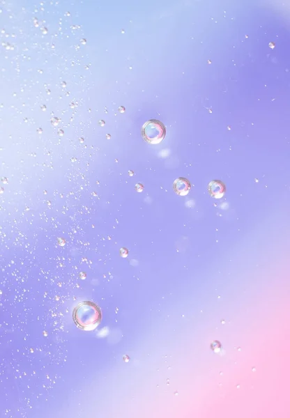 Kozmetikai Termékek Géltextúrája Átlátszó Krém Kék Rózsaszín Háttérrel Buborékokkal Makró — Stock Fotó