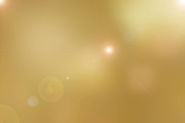 Bulanık altın tonuyla soyut parlak arka plan. Uzayı kopyala, lens flaşlı gradyan. 
