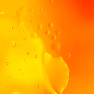 Parlak Turuncu Macro Baloncukları. Canlı turuncu ve sarı tonlarda sıvı kabarcıkların makro soyut fotoğrafı. 