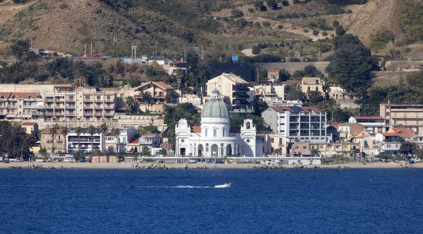 Church and homes in City by the Sea. Messina, Sicilia, Italy. Sunny Morning.