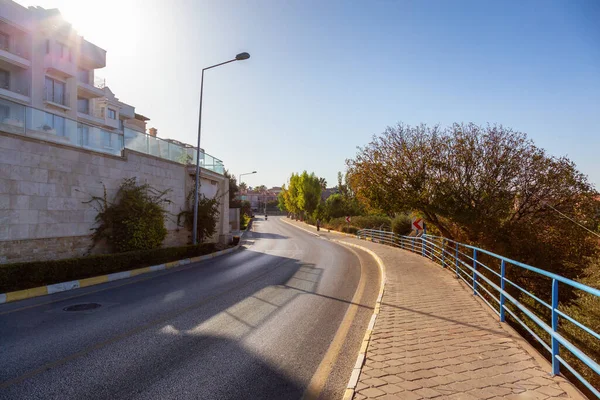 stock image Road, homes and trees in a Touristic Town. Kusadasi, Turkey. Sunny Morning