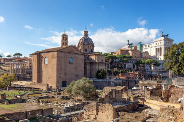 Ancient Remains in Rome, Italy. Roman Forum. Sunny Cloudy Sky.