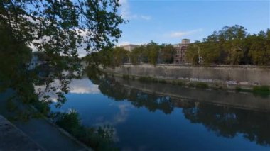 River Tiber and Bridge in a historic City, Rome, Italy. Sunny and Cloudy day. Cinematic Slow Motion
