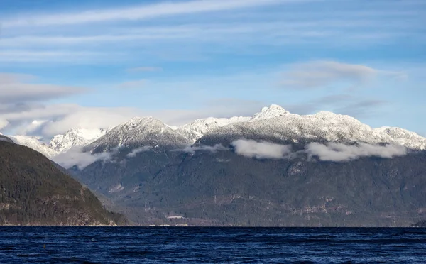 Canadian Mountain Landscape Nature Background. Sunny Winter Day. Howe Sound near Squamish, British Columbia, Canada.