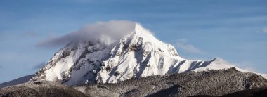 Garibaldi Mountain covered in snow and clouds. Canadian Nature Landscape Background. Winter Season in Squamish, British Columbia, Canada.