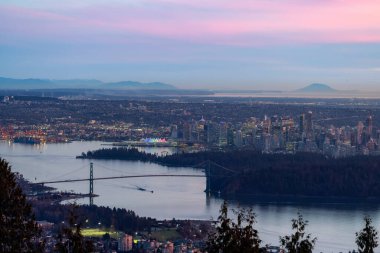 Urban Downtown City and Stanley Park in Vancouver, British Columbia, Canada. Winter Sunset.